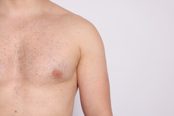 Man standing on light background, closeup. Space for text