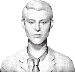 A serious man with short hair gazes intently forward.