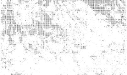 Fototapeta premium A textured speckled surface displays a gradient of white and gray tones.