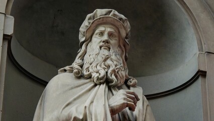 Florence, Italy - 3 January 2025. Marble statue of Leonardo da Vinci, sculpted by Luigi Pampaloni...