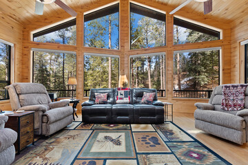 Cozy living room with a comfy couch, stylish chairs, and rug