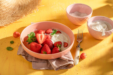 Tasty and homemade strawberries served in summer sunny day.