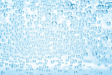 Soda water with bubbles as background, closeup