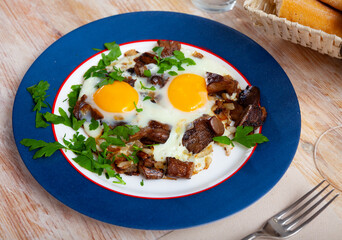 Image of plate with fried eggs with mushrooms and greens, nobody