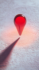 Glossy red location pin hovers over a stark white surface, casting a soft shadow beneath it; a vibrant pop of color in a minimalist space symbolizing direction, presence, and digital navigation.

