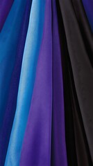 Elegant textile background of draped fabric with cool hues arrangement