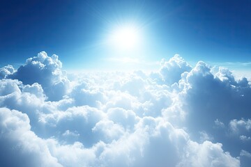 High-altitude view of a bright, sunlit sky filled with puffy white clouds