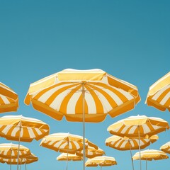 Pattern of yellow-white striped beach umbrellas against pure blue sky, geometric simplicity, summer minimalism with 30% negative space