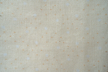 Light beige fabric with subtle polka dots pattern