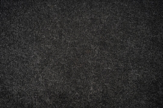 Textured dark gray felt surface close-up