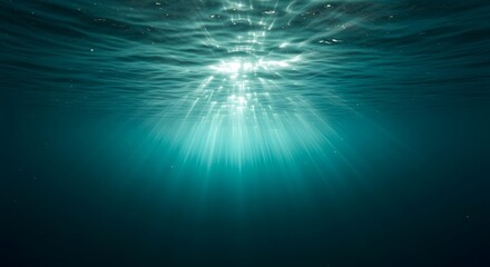 Obraz premium Underwater Ocean Scene Sunbeams Shining Through the Turquoise Water, Deep Sea.