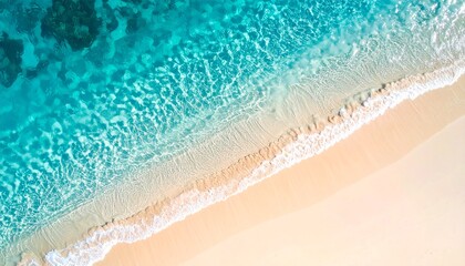 Obraz premium Clear turquoise water on sandy beach, top view image