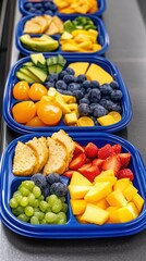 Colorful Fruit Platter with Cake and Yellow Tomatoes in Blue Compartments