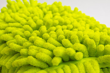 Close up of yellow microfiber car wash mitt with tendrils car wash detailing