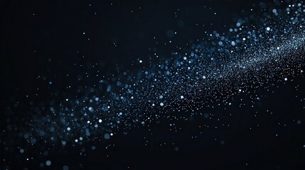 Obraz premium A stream of glowing light particles and bokeh dots on a dark background, resembling a starry night or cosmic dust.