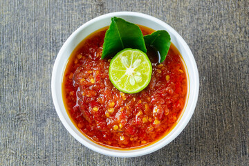 Sambal Taliwang served on white bowl. traditional Indonesian chili sauce from Lombok. Sambal Taliwang is also perfect as a condiment for grilled meats, seafood, or rice dishes