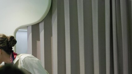 Safety belt in-flight safety demonstration : Air hostess staff airline demonstrate. Cabin Crew or Steward staff airline demonstrate safety procedures to passengers. Flight attendant