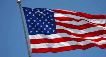 Obraz premium American Flag Waving Against Blue Sky