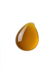 Single drop of amber liquid, glossy and reflective  Close-up view against white background  Viscous, potentially sweet,  smooth texture