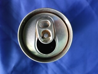 Aluminum can on a blue background. Close-up top of can  view.photo taken in malaysia
