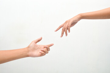 male and female hands reaching towards each other on isolated white background