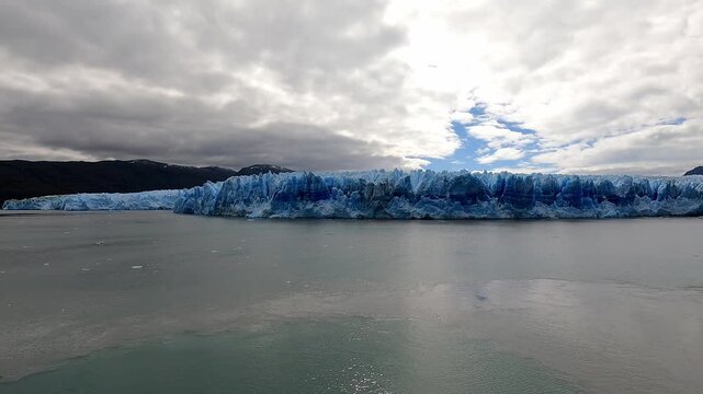 Slow pan from left to right from a ship of the PIO XI Glacier in Chile Torres del Paine showing the deep blue hue of the glacier