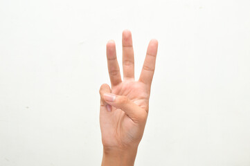 Naklejka premium young man hand showing three fingers or number three isolated on white background. Counting concept