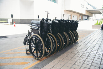 Rows of wheelchairs parking for disability patient services in medical hospital with copy space. Group of wheelchairs Row hospital service for handicap equipment disability person. Healthy Lifestyle
