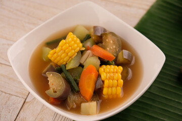 Sayur asem. Sayur asam is a type of sour vegetable dish typical of Indonesia. served on a ceramic bowl.