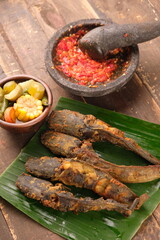 Pecel Lele, sambal, sayur Asem. fried catfish chili sauce, sour vegetables. Indonesian food.