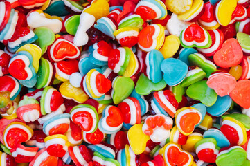 background of colorful jelly hearts. Top view of the candy