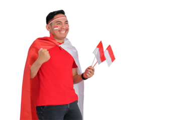 Excited young Asian man celebrating Indonesian independence day holding the Indonesian flag isolated on transparent background