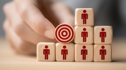 Individual strategically placing a red into a tower of wooden blocks to demonstrate emotional precision concepts