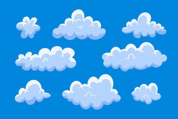 Set of cartoon cloud in a flat design. Fluffy white cartoon clouds in blue sky vector set.
