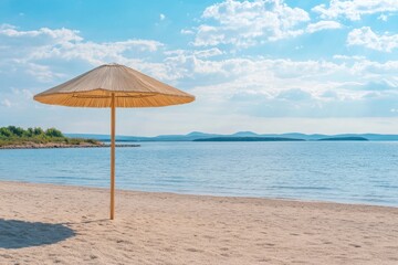 Fototapeta premium Beach with umbrella and beautiful sky background