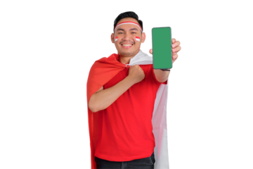 Cheerful young Asian man showing a blank screen mobile phone isolated on transparent background. Indonesian independence day concept