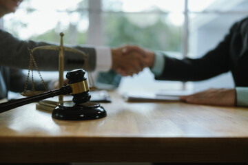 Professional lawyer advising client on legal contractsensuring justice, compliance, and financial protection in corporate agreements, court matters, and investments.