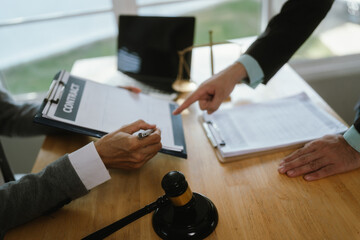 Professional lawyer advising client on legal contracts—ensuring justice, compliance, and...