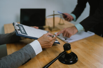 Professional lawyer advising client on legal contracts—ensuring justice, compliance, and...