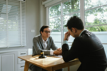 Professional lawyer advising client on legal contracts—ensuring justice, compliance, and financial protection in corporate agreements, court matters, and investments.