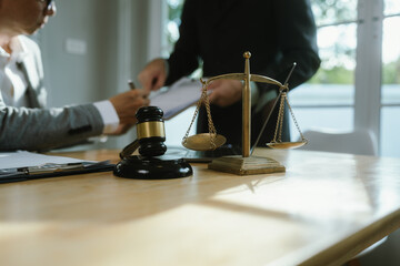 Professional lawyer advising client on legal contracts—ensuring justice, compliance, and...