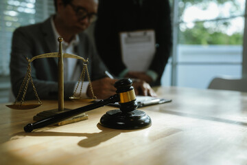 Professional lawyer advising client on legal contracts—ensuring justice, compliance, and financial protection in corporate agreements, court matters, and investments.