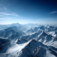 Obraz premium Majestic Snow-Capped Mountains Stretch to the Horizon Under a Clear Blue Sky, a Serene and Breathtaking Winter Landscape 