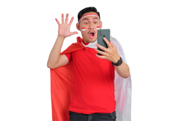 Shocked young Asian man using a mobile phone isolated on transparent background. Indonesian independence day concept