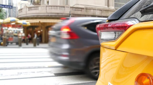 New York City Grand Central Terminal railway station, 42 street. Manhattan Midtown. Yellow taxi cabs, car transport on Pershing Square, NYC USA. American urban road traffic, people,telephone box kiosk