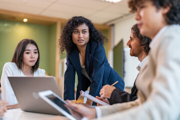 Leadership training, executive communication and team development in progress with diverse professionals in coaching seminar, strategic thinking and interpersonal skills in a modern workplace