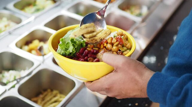 Healthy bowl of fresh ingredients at a salad bar location