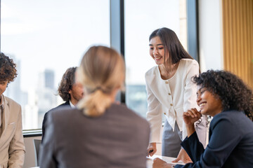 Leadership training, executive communication and team development in progress with diverse professionals in coaching seminar, strategic thinking and interpersonal skills in a modern workplace