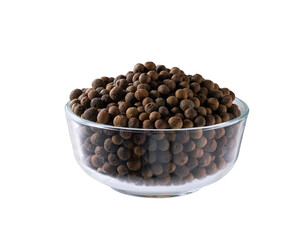 allspice or Jamaican pepper in a transparent bowl  isolated on white background.