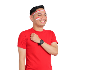Happy young Asian man celebrate Indonesian independence day with hand on chest feeling proud isolated on transparent background